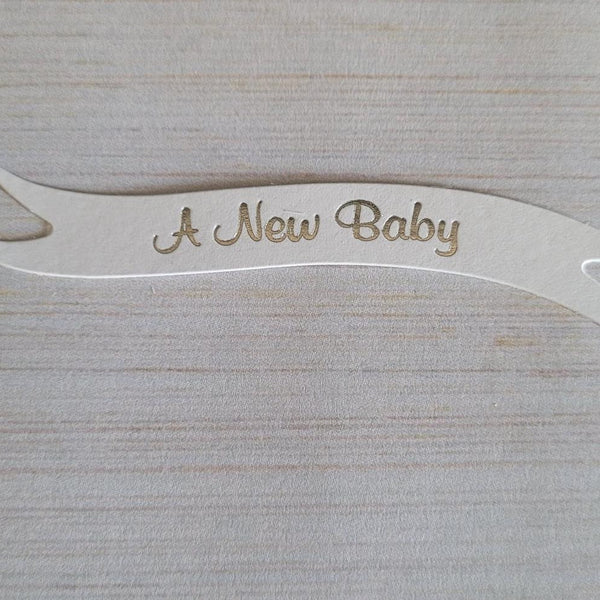 Banners - A New Baby. Silver on White card. Pack of 10