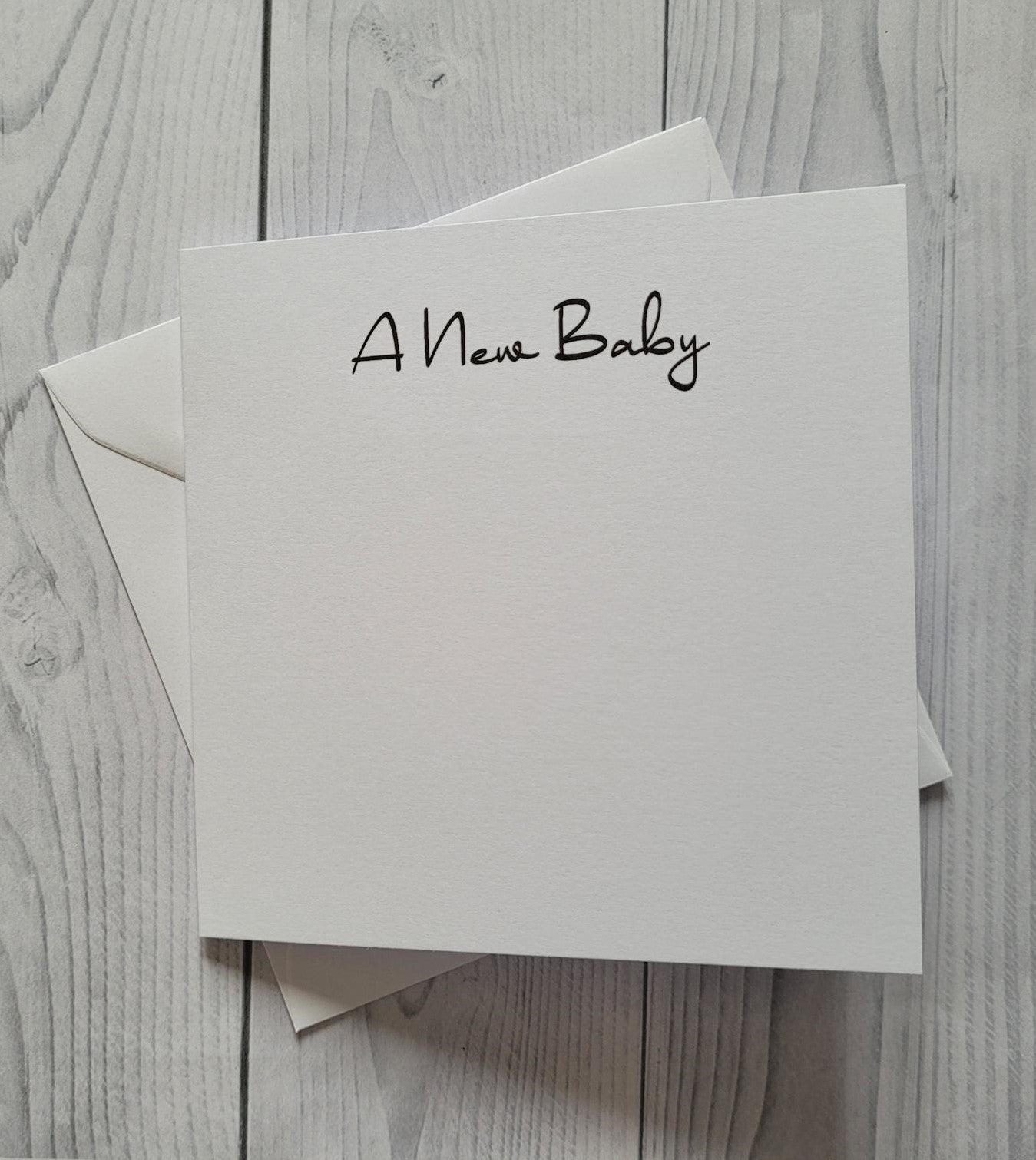 Card blanks and envelopes 6"x6", printed A New Baby in black